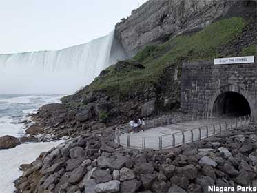 Tourists dwarfed on the viewing platform at the base of the Falls.