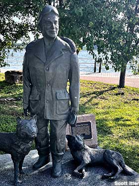Statue of dogs and musher William 