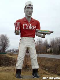 Muffler Man with Coke and hot dog.